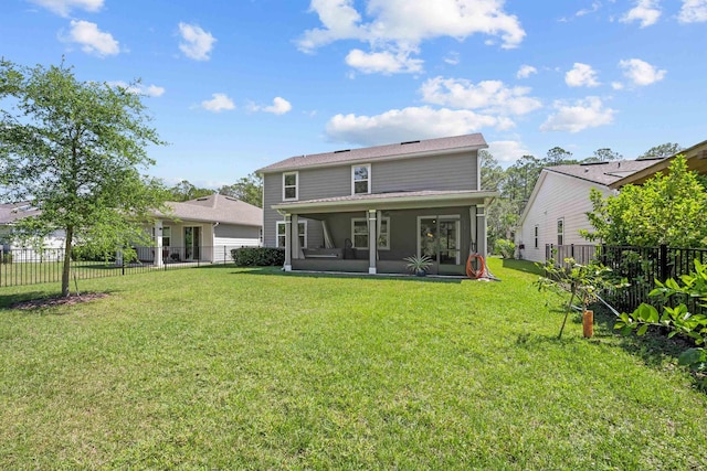 249 La Mancha Dr, Saint Augustine, FL 32086 - back of property with a lawn, a sunroom, and fence