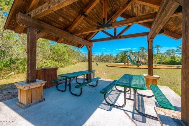 249 La Mancha Dr, Saint Augustine, FL 32086 - surrounding community featuring a lawn, playground community, and a patio