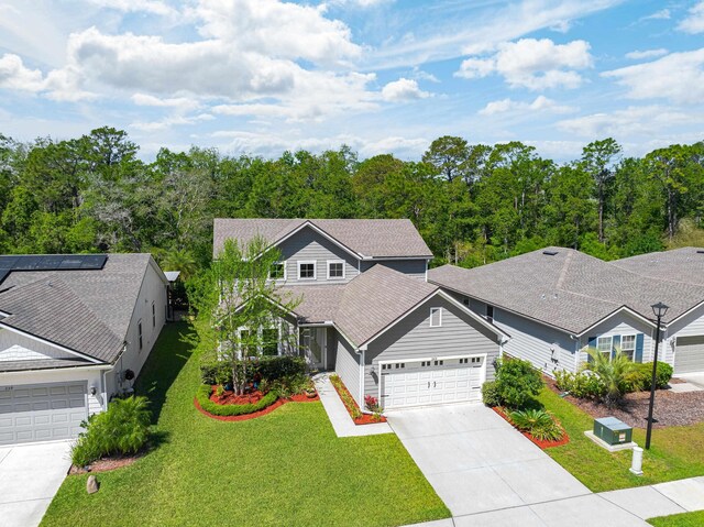 249 La Mancha Dr, Saint Augustine, FL 32086 - view of front of property with a front lawn, driveway, and an attached garage
