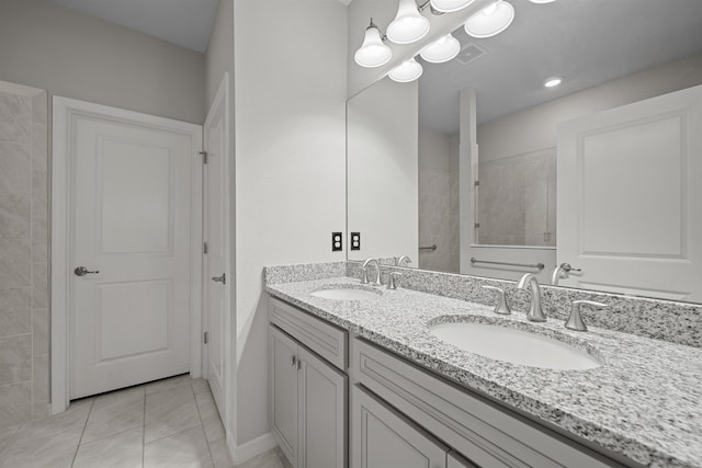 249 La Mancha Dr, Saint Augustine, FL 32086 - bathroom with double vanity, visible vents, tile patterned flooring, and a sink