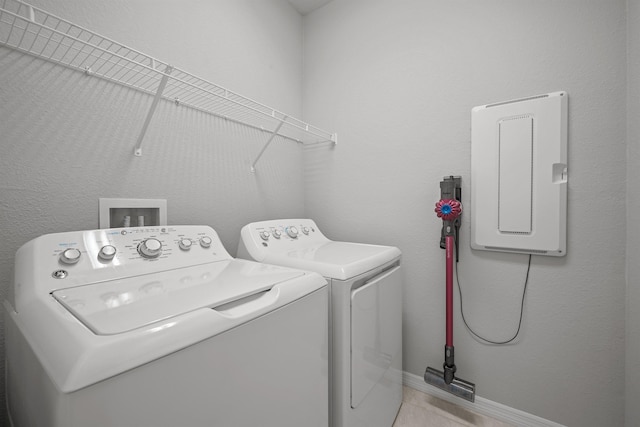 249 La Mancha Dr, Saint Augustine, FL 32086 - washroom featuring baseboards, washing machine and clothes dryer, laundry area, and light tile patterned floors