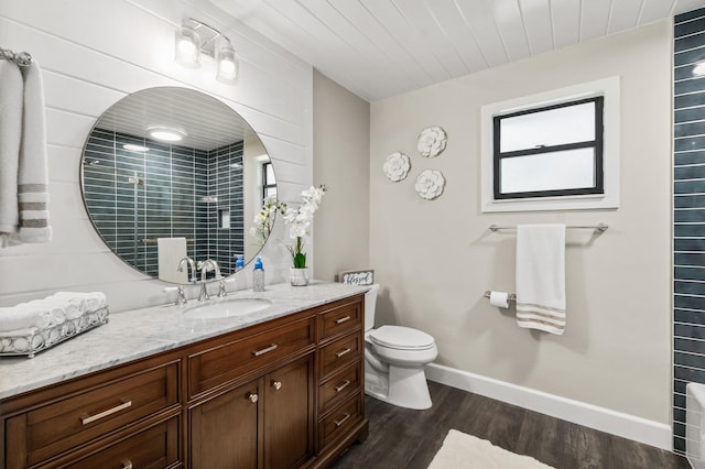 full bathroom featuring toilet, wood finished floors, wood ceiling, vanity, and baseboards