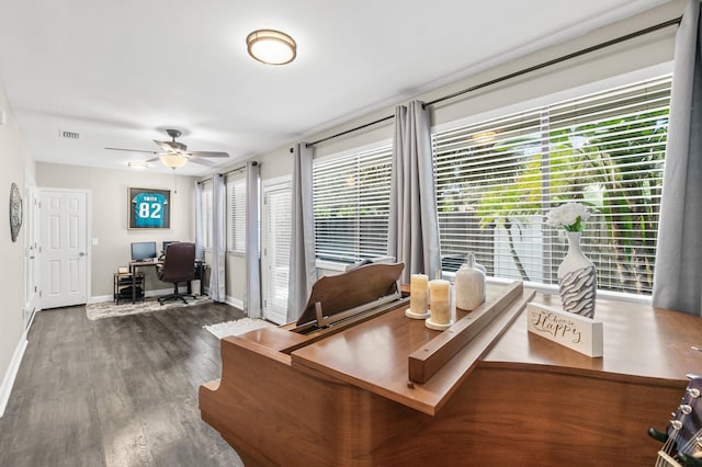 office space with ceiling fan, wood finished floors, visible vents, and baseboards