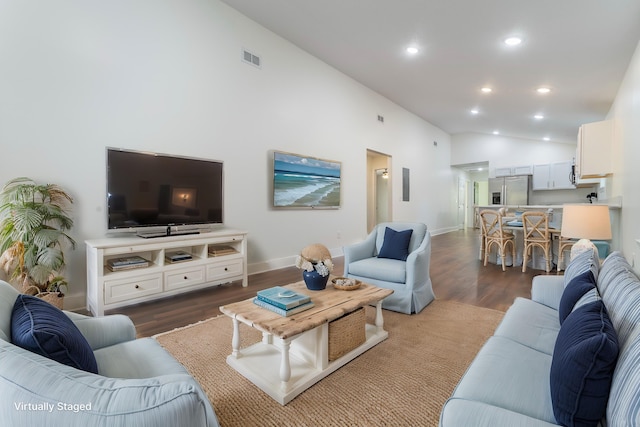 living area with recessed lighting, visible vents, baseboards, vaulted ceiling, and dark wood finished floors