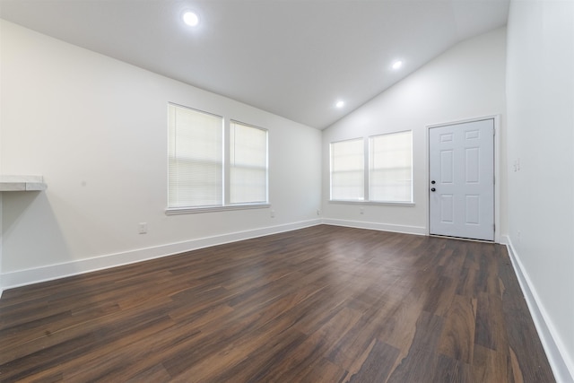 empty room with dark wood-type flooring, recessed lighting, and baseboards