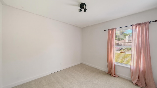 2169 Saint Martins Dr, Jacksonville, FL 32246 - spare room with baseboards and light carpet