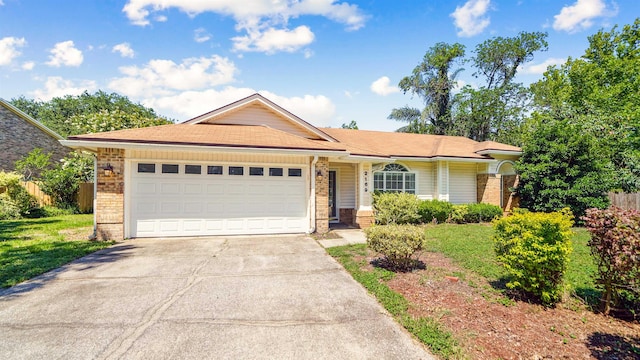 2169 Saint Martins Dr, Jacksonville, FL 32246 - single story home with brick siding, an attached garage, and driveway