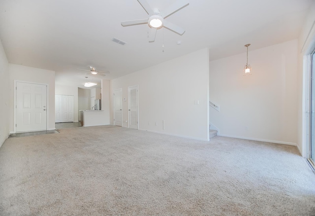22 Buckley Ct, Saint Augustine, FL 32086 - unfurnished living room with a ceiling fan, stairway, and light colored carpet