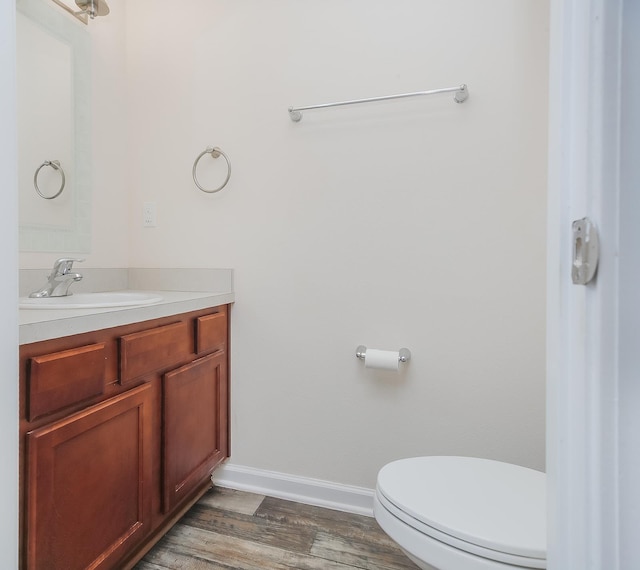 22 Buckley Ct, Saint Augustine, FL 32086 - half bathroom featuring vanity and wood finished floors