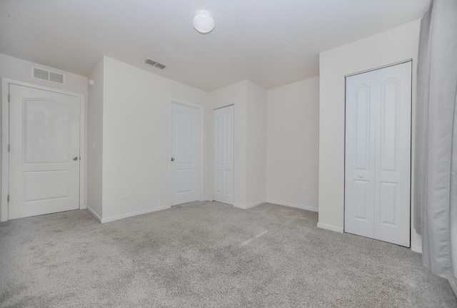 22 Buckley Ct, Saint Augustine, FL 32086 - unfurnished bedroom with carpet floors and two closets