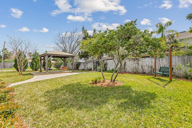 view of yard featuring fence and a gazebo