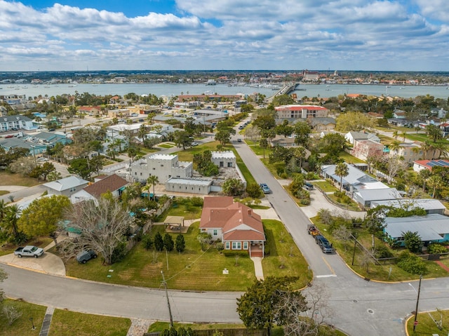 birds eye view of property with a residential view and a water view