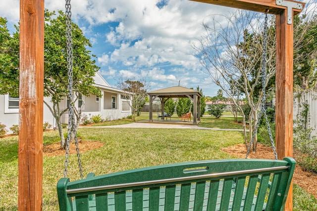 view of yard with a patio area, fence, and a gazebo