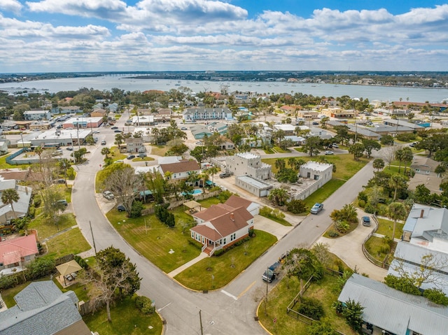 bird's eye view with a residential view and a water view