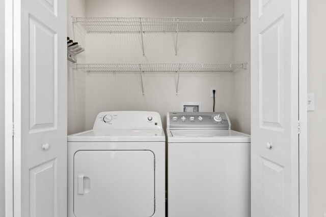 laundry area with laundry area and washing machine and dryer