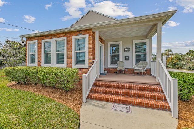 view of front of property with covered porch and stucco siding