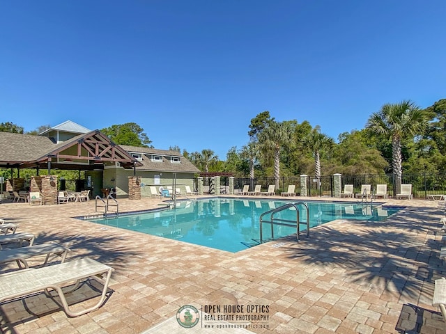 view of swimming pool with a patio area