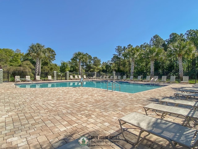 view of swimming pool with a patio