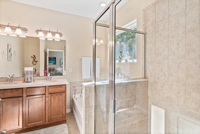 bathroom featuring tile patterned floors, vanity, and separate shower and tub