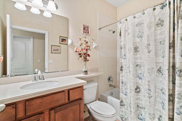 full bathroom with vanity, shower / tub combo, and toilet