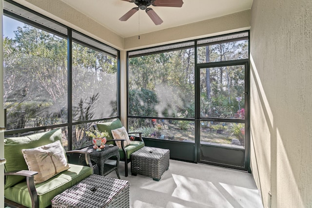 sunroom featuring ceiling fan