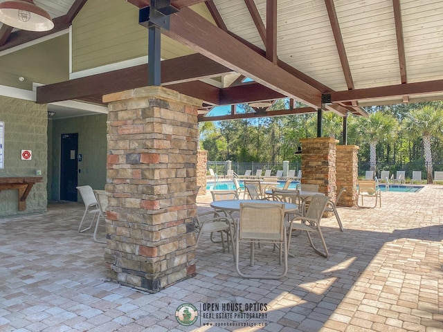 view of patio with a gazebo and a community pool