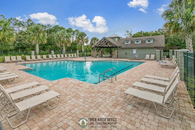 view of pool featuring a patio