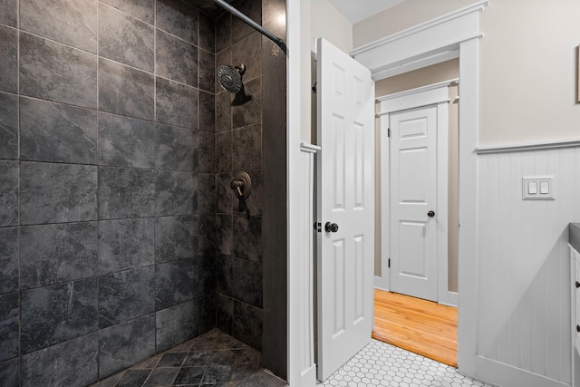 full bath featuring a tile shower