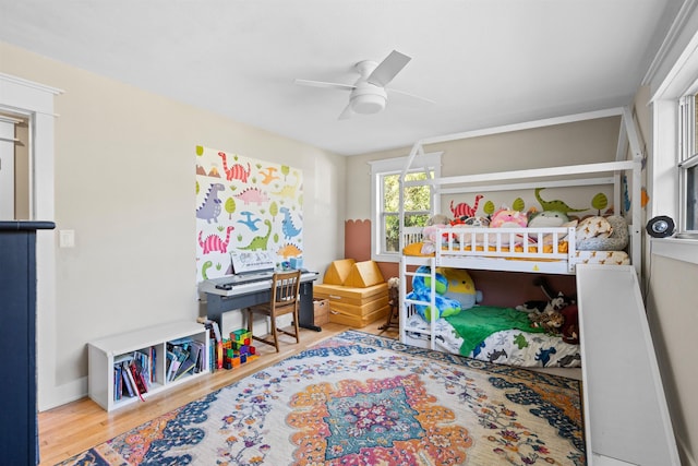 bedroom with ceiling fan and wood finished floors