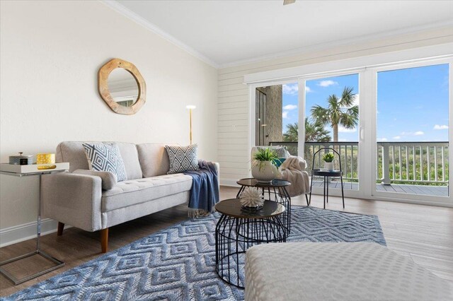 3385 Coastal Hwy Unit 23, Saint Augustine, FL 32084 - living room with ornamental molding, wood finished floors, and lofted ceiling