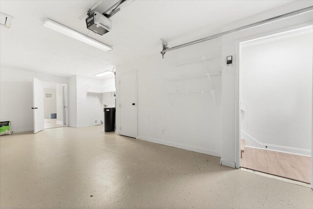 3385 Coastal Hwy Unit 23, Saint Augustine, FL 32084 - garage featuring a garage door opener and baseboards