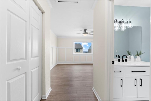 3385 Coastal Hwy Unit 23, Saint Augustine, FL 32084 - corridor with crown molding and dark wood finished floors