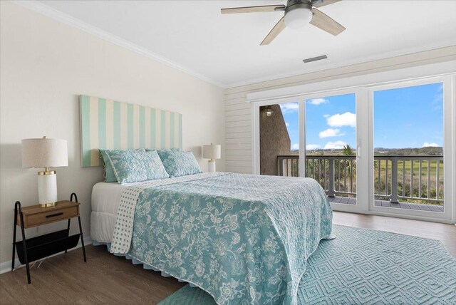 3385 Coastal Hwy Unit 23, Saint Augustine, FL 32084 - bedroom featuring access to exterior, wood finished floors, ornamental molding, and a ceiling fan