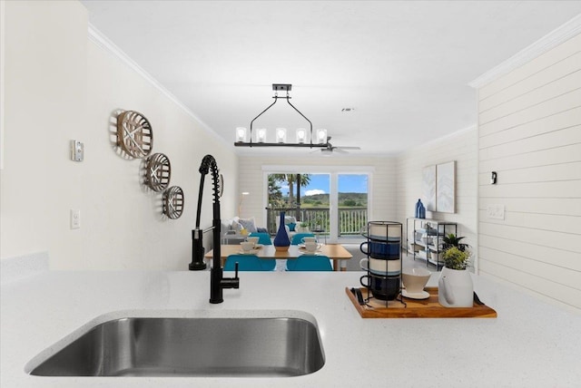 3385 Coastal Hwy Unit 23, Saint Augustine, FL 32084 - kitchen view of crown molding, a ceiling fan, and light countertops