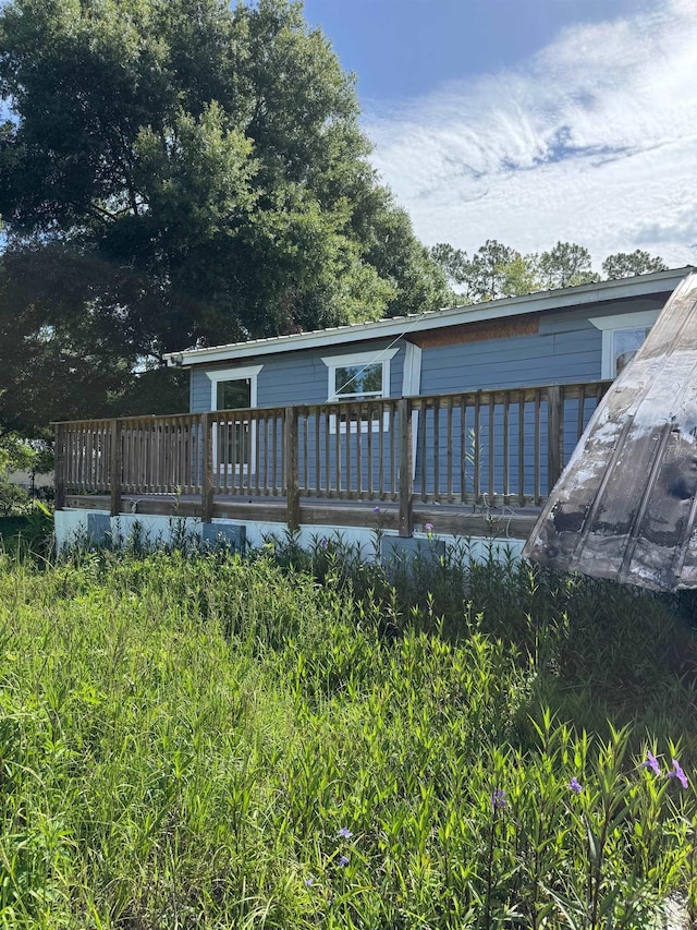 9610 Ebert Ave, Hastings, FL 32145 - rear view of house featuring a wooden deck