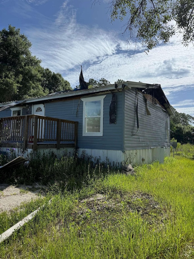 9610 Ebert Ave, Hastings, FL 32145 - view of home's exterior with a wooden deck