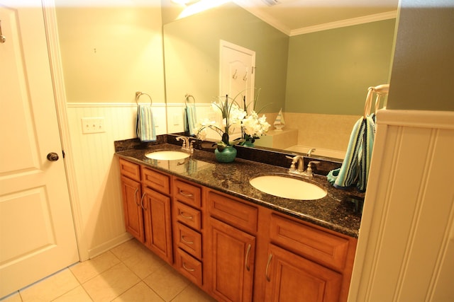 full bath with tile patterned flooring, double vanity, a sink, and ornamental molding