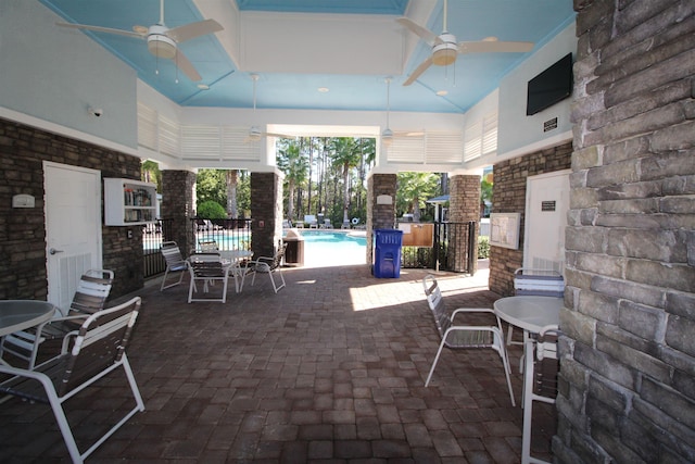 view of patio / terrace with a community pool, visible vents, and a ceiling fan