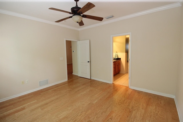 unfurnished bedroom featuring crown molding, visible vents, baseboards, and light wood-style floors
