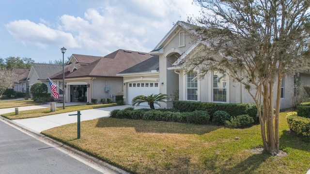 view of front facade with a garage and a front yard