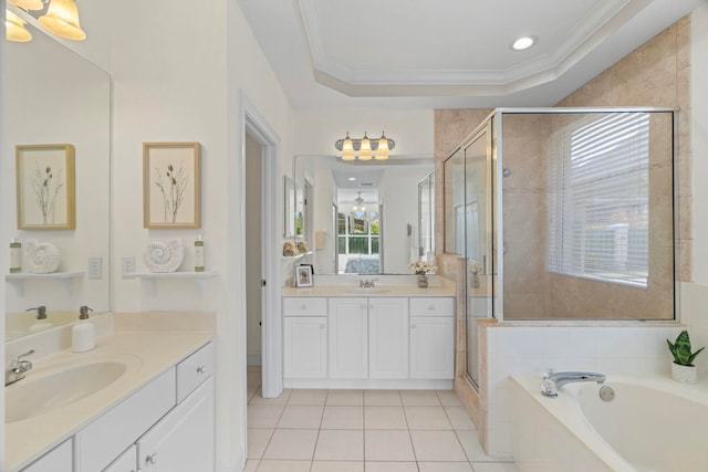 bathroom with vanity, crown molding, plus walk in shower, and a raised ceiling