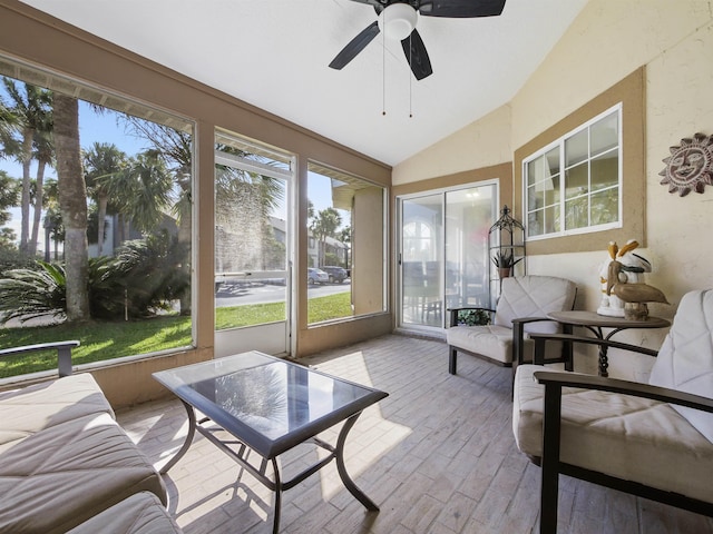 sunroom / solarium featuring ceiling fan and lofted ceiling