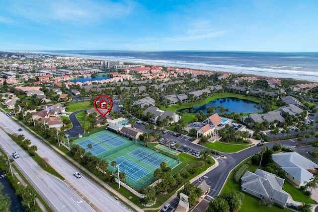 aerial view with a water view and a view of the beach