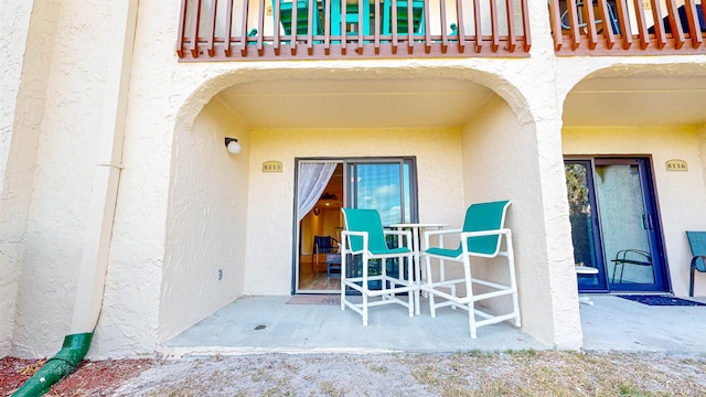 entrance to property with a balcony