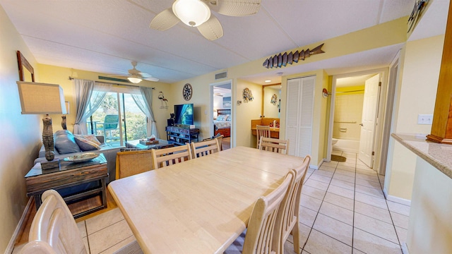 dining room with ceiling fan and light tile patterned floors