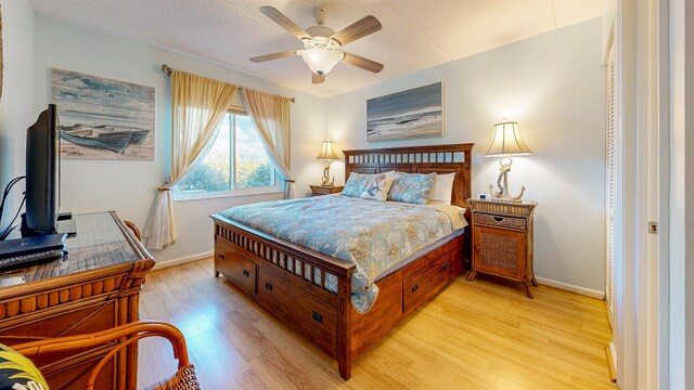 bedroom featuring light hardwood / wood-style floors and ceiling fan