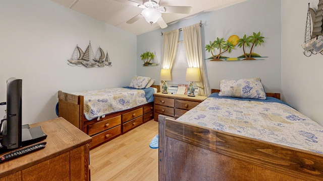 bedroom with ceiling fan and light hardwood / wood-style floors