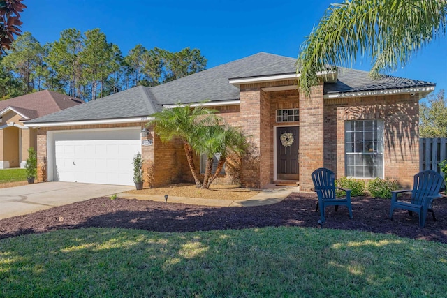 view of front facade with a front lawn and a garage