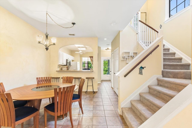 dining space with stairway, light tile patterned floors, visible vents, baseboards, and recessed lighting