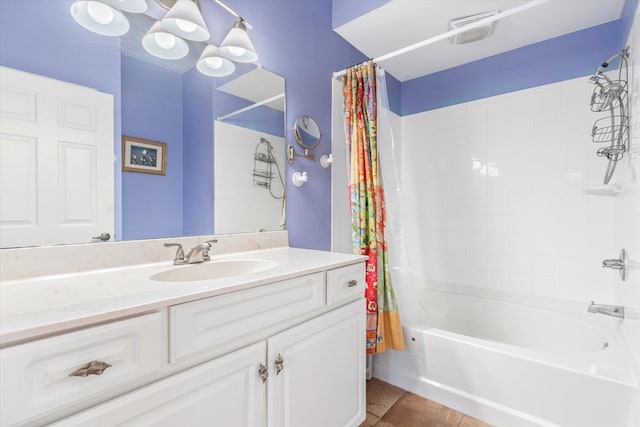 full bath featuring tile patterned floors, vanity, and shower / bath combination with curtain